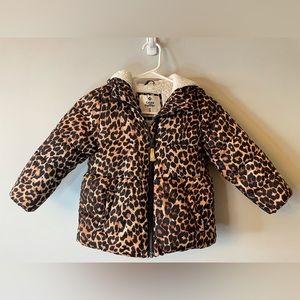 Girls Sherpa fleece lined puffer with peplum style body with Cheetah print.